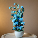 White Flower Waise Along With Plastic Leaves And Blue Flowers