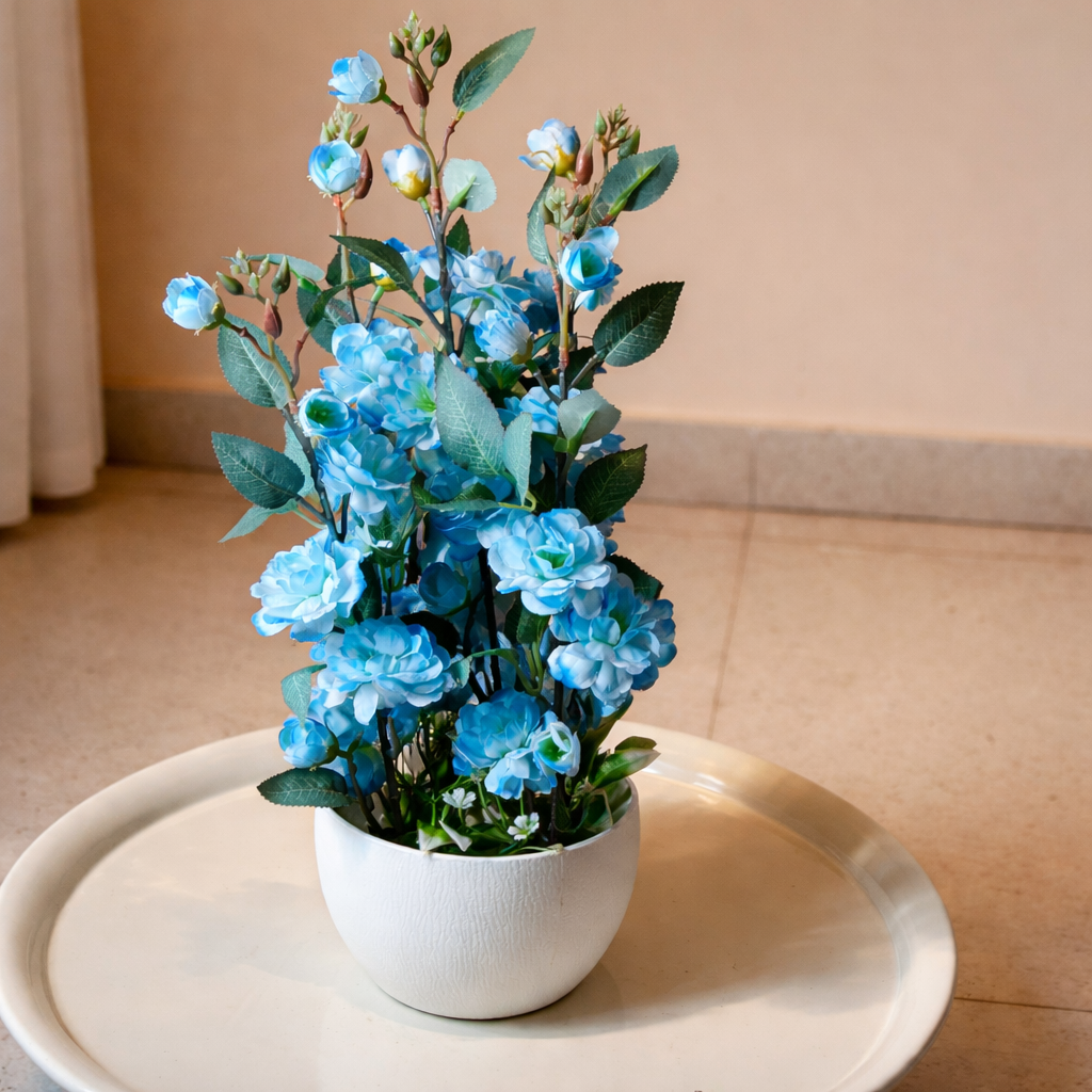 White Flower Waise Along With Plastic Leaves And Blue Flowers