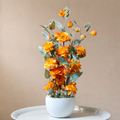 White Flower Waise Along With Plastic Leaves And Orange Flowers